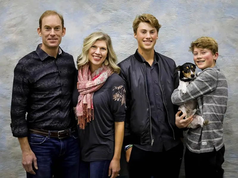 Amy Nakos with her family and dog in the mountains
