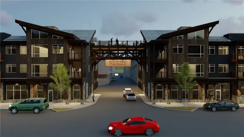 Rendering of a modern building complex with a bridge labeled 4th Street Crossing connecting two buildings, cars on the street, and people on sidewalks and the bridge.
