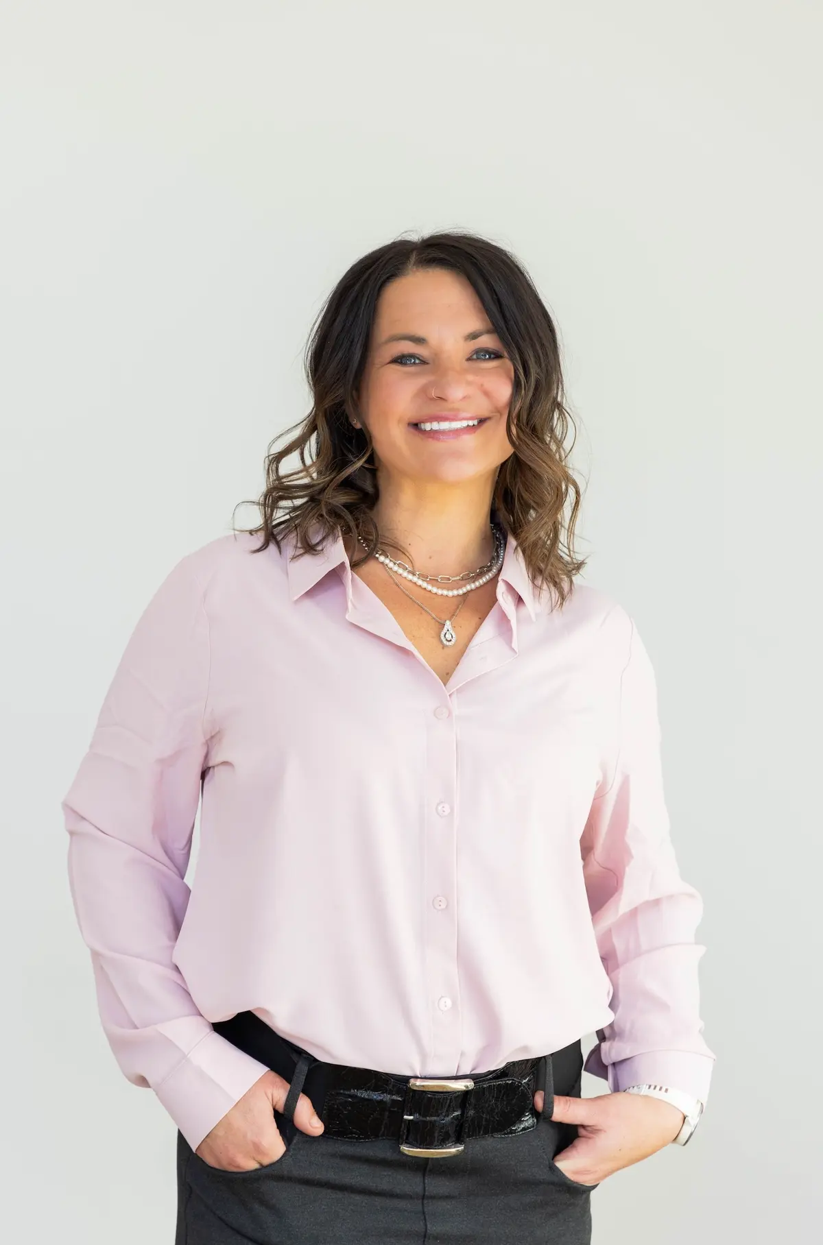 Portrait of Jennifer Luberto in a light pink blouse