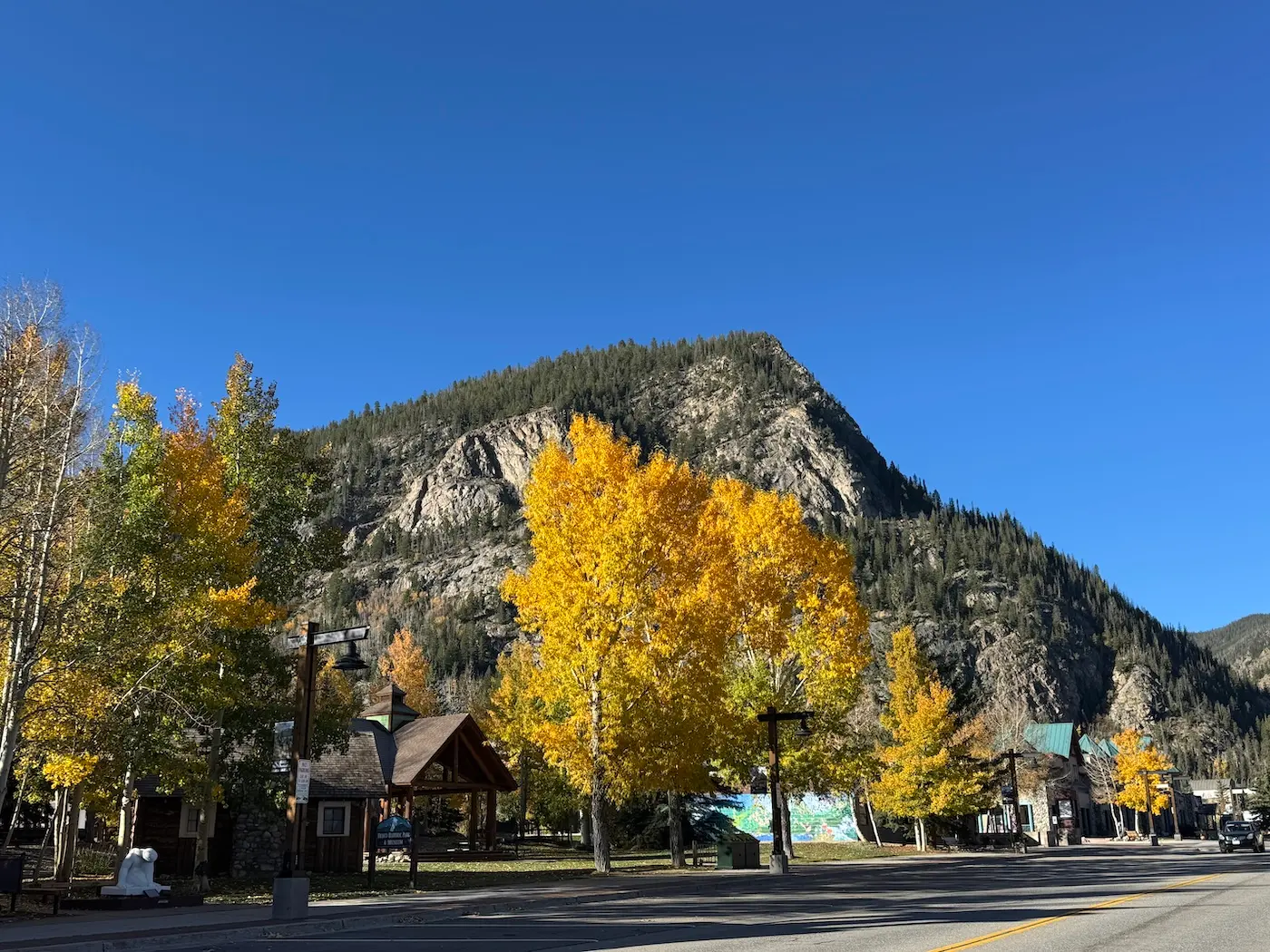 Mount Royal rising above golden aspens and buildings in Frisco, Colorado